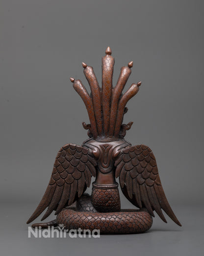 Back view of Oxidized Nagakanya sculpture revealing detailed cobra headdress and finish