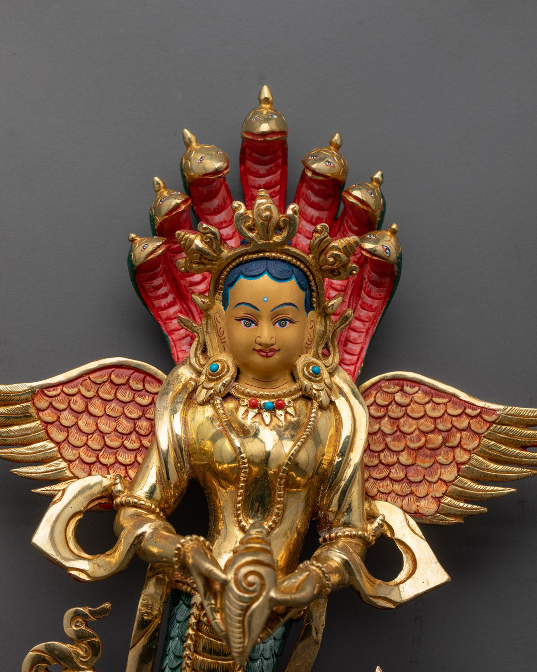 Close-up of Naga Kanya’s serene face and detailed serpent design