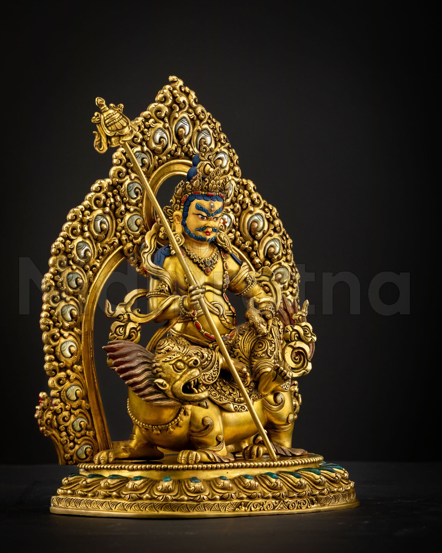 Side view of Namtoshe statue showing intricate body carvings flowing ornaments and detailed Himalayan craftsmanship with radiant gold gilded copper structure