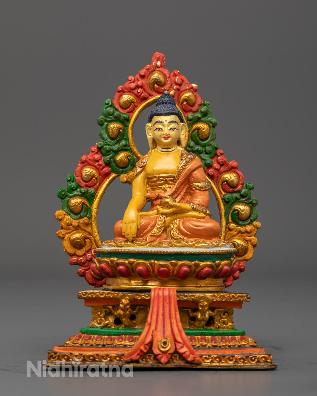 Nepalese Divine Buddha Shakyamuni Sculpture with gold-plated face and copper body adorned with vibrant acrylic colors and multicolored halo