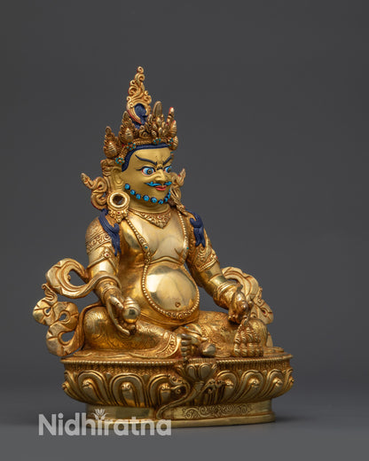 Nepalese Dzambhala statue seated on lotus holding citrion fruits and jewels