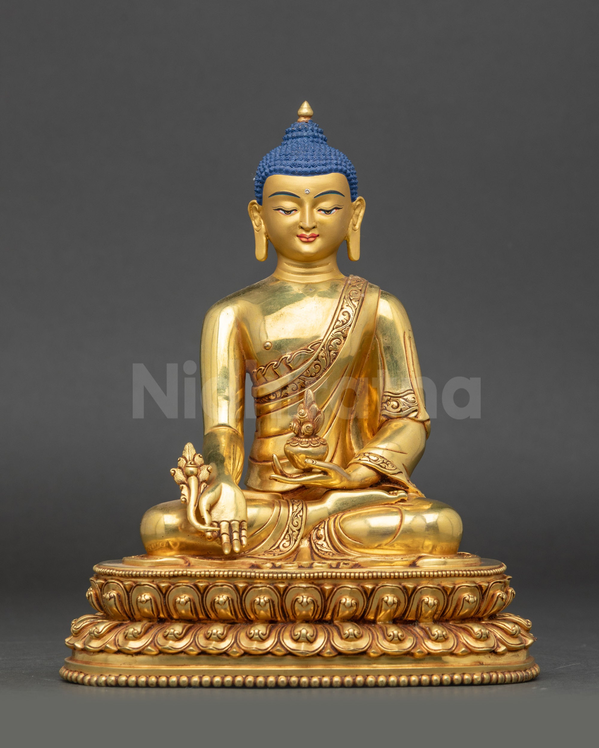 Front view of Nepalese Medicine Buddha statue on lotus pedestal for meditation and healing