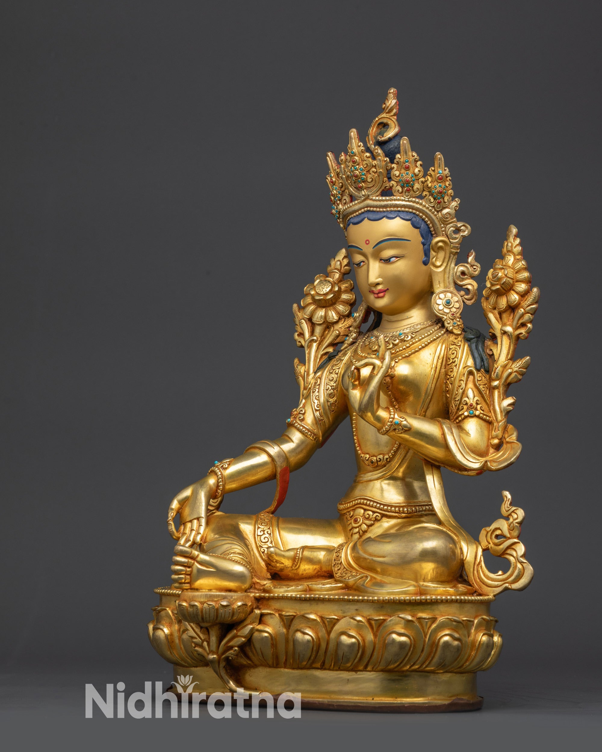 Nepalese Green Tara Statue left side view Vitarka mudra holding Utpala flower