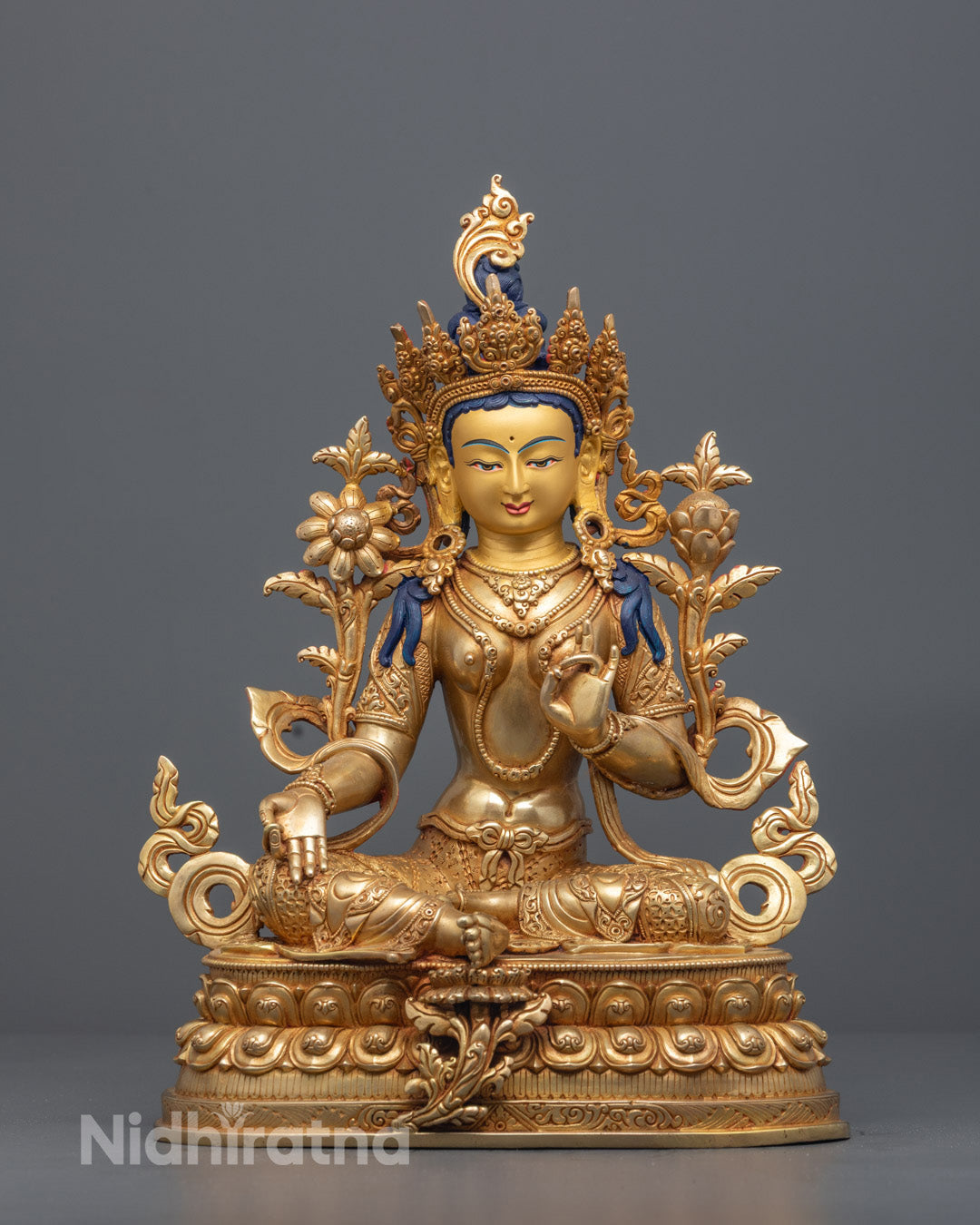 Nepalese Mother Tara statue with gold-gilded face and 24K gold fire-gilded body holding blue uptala flower