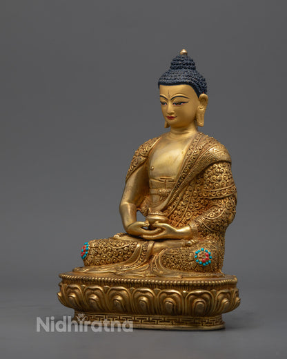 Nepalese artisan-crafted Amitabha Buddha sculpture with radiant 24k fire-gilded copper and colorful accents, symbolizing compassion and wisdom.
