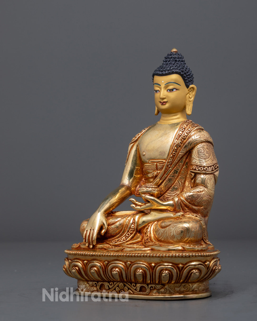 Nepalese artisan-crafted Shakyamuni Buddha statue in meditative posture, fire-gilded with 24k gold and decorated with acrylic paint