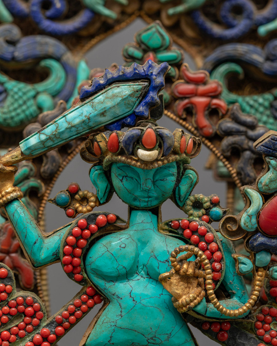 Nepalese traditional lost wax Manjushri sculpture with intricate details and multi-colored acrylic paint finish.