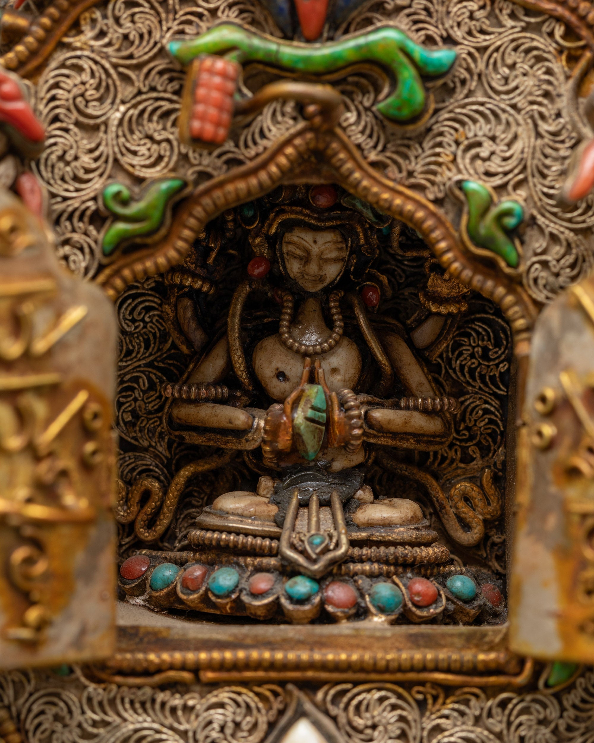 Open Chenrezig Ghau Box showcasing the sacred deity inside

