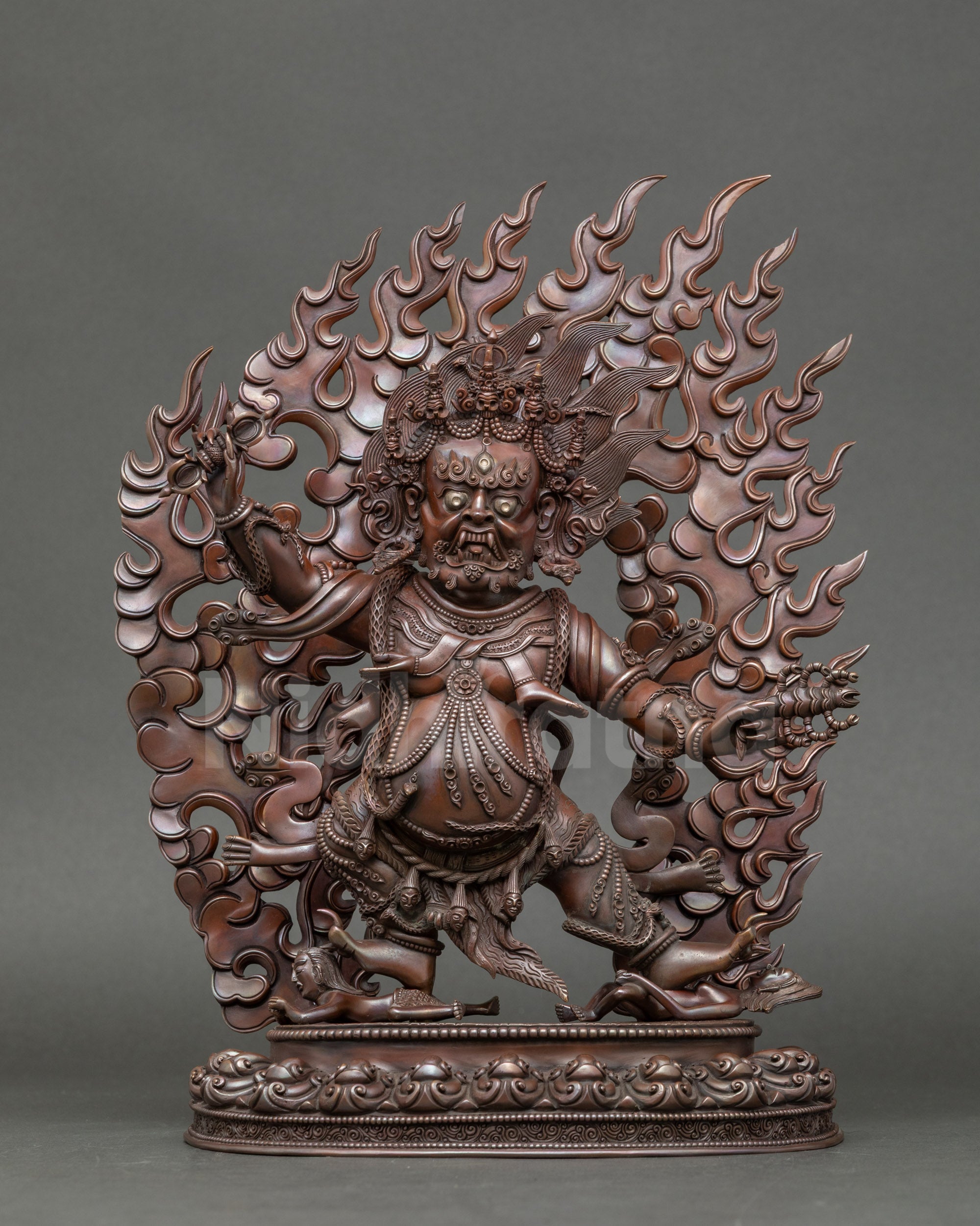 Oxidized Copper Guru Dragpo Statue front view with wrathful expression and lotus seat
