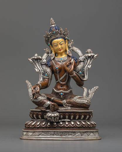 Oxidized Green Tara Statue front view with 24K gold face, silver robe, lotus base.