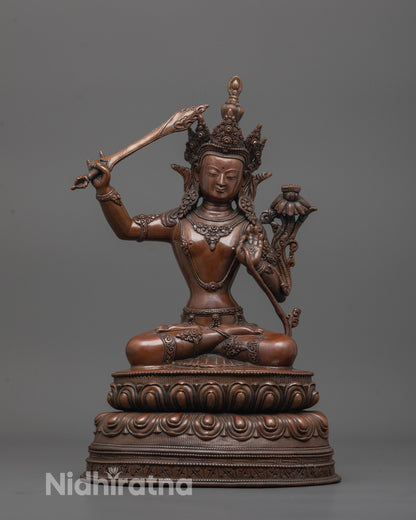 Oxidized Manjushri Statue front view showing lotus base and wisdom sword