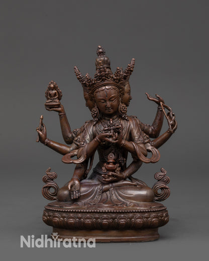 Oxidized Namgyalma Statue with three faces and eight arms seated on lotus base symbolizing longevity and purity