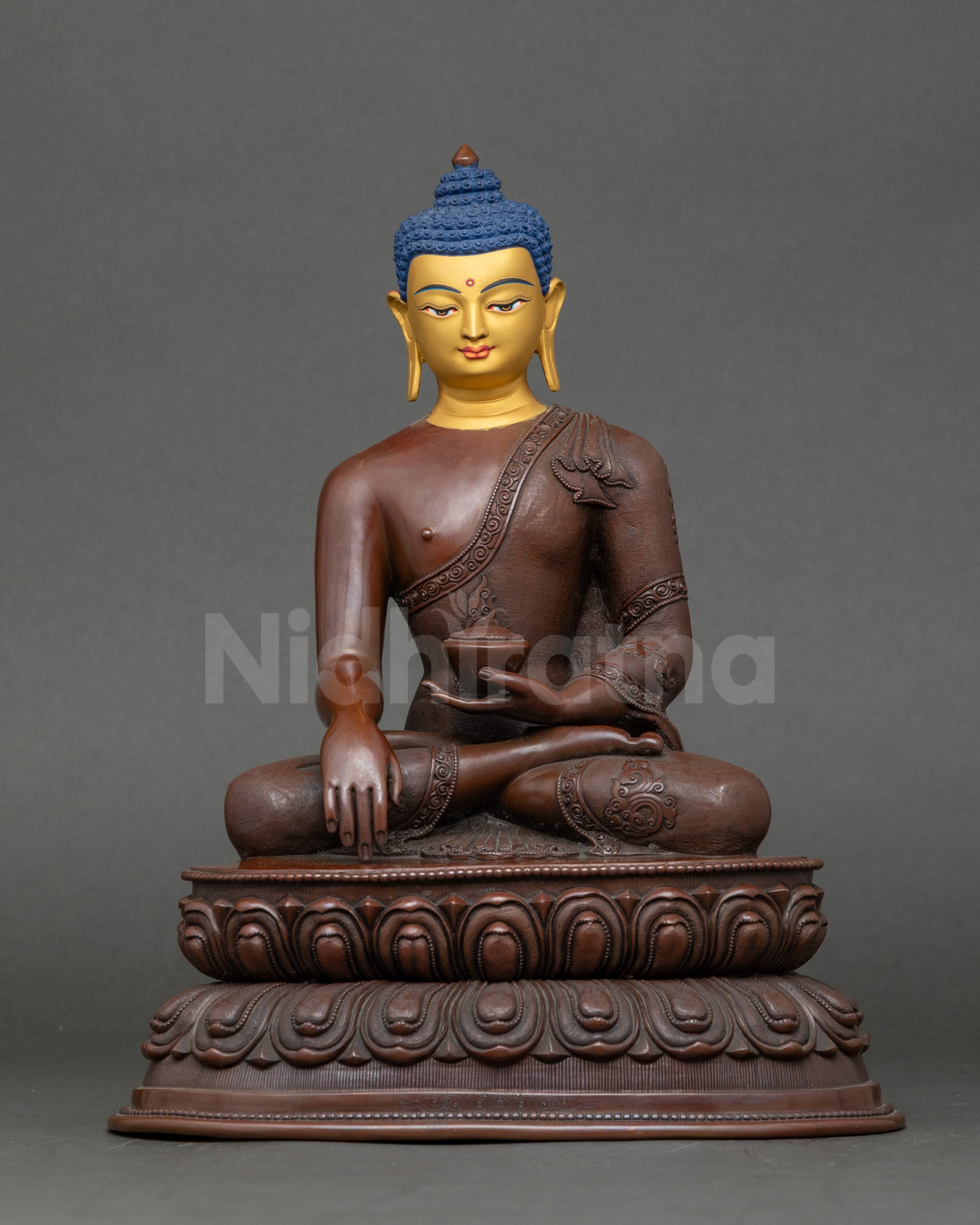 Oxidized Shakyamuni Buddha statue with 24K gold face seated on double lotus throne