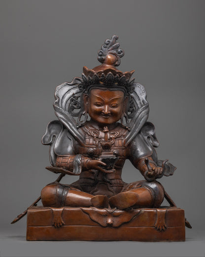 Oxidized copper Vaisravana statue seated in a regal posture, embodying the guardian