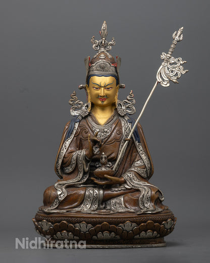 hand-carved Guru Rinpoche Statue with 24K gold-gilded face and silver-plated details, seated on a lotus throne.