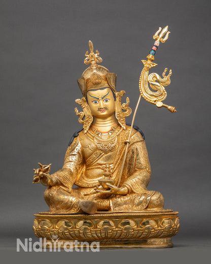 Padmasambhava Guru Rinpoche statue seated on lotus throne, copper sculpture with gold gilding
