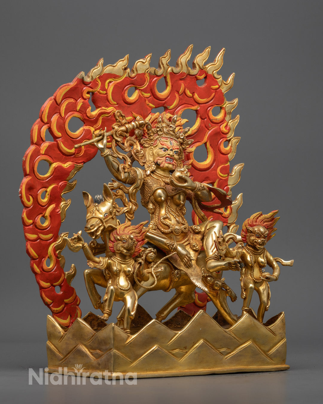 Palden Lhamo protector goddess holding a trident with three kapalas symbolizing transformation of poisons into wisdom.
