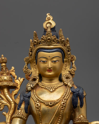 Prajna Paramita's serene gold-gilded face and ornate crown, showcasing traditional lost wax craftsmanship and sacred Buddhist symbolism.
