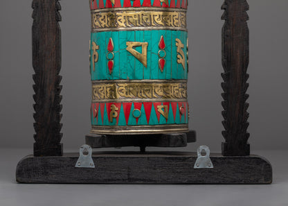 Prayer Wheel spinning on dark wooden base, perfect for meditation and blessing rituals