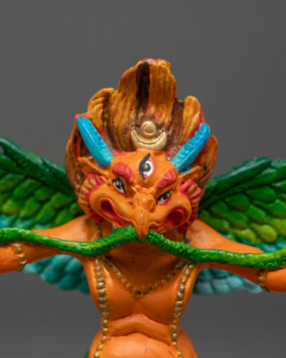 Premium electroplated Garuda statue standing on multi-colored lotus throne symbolizing purity and spiritual awakening