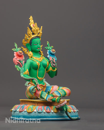 Green Tara in ready-to-rise posture on lotus throne, showcasing intricate copper craftsmanship and green patina