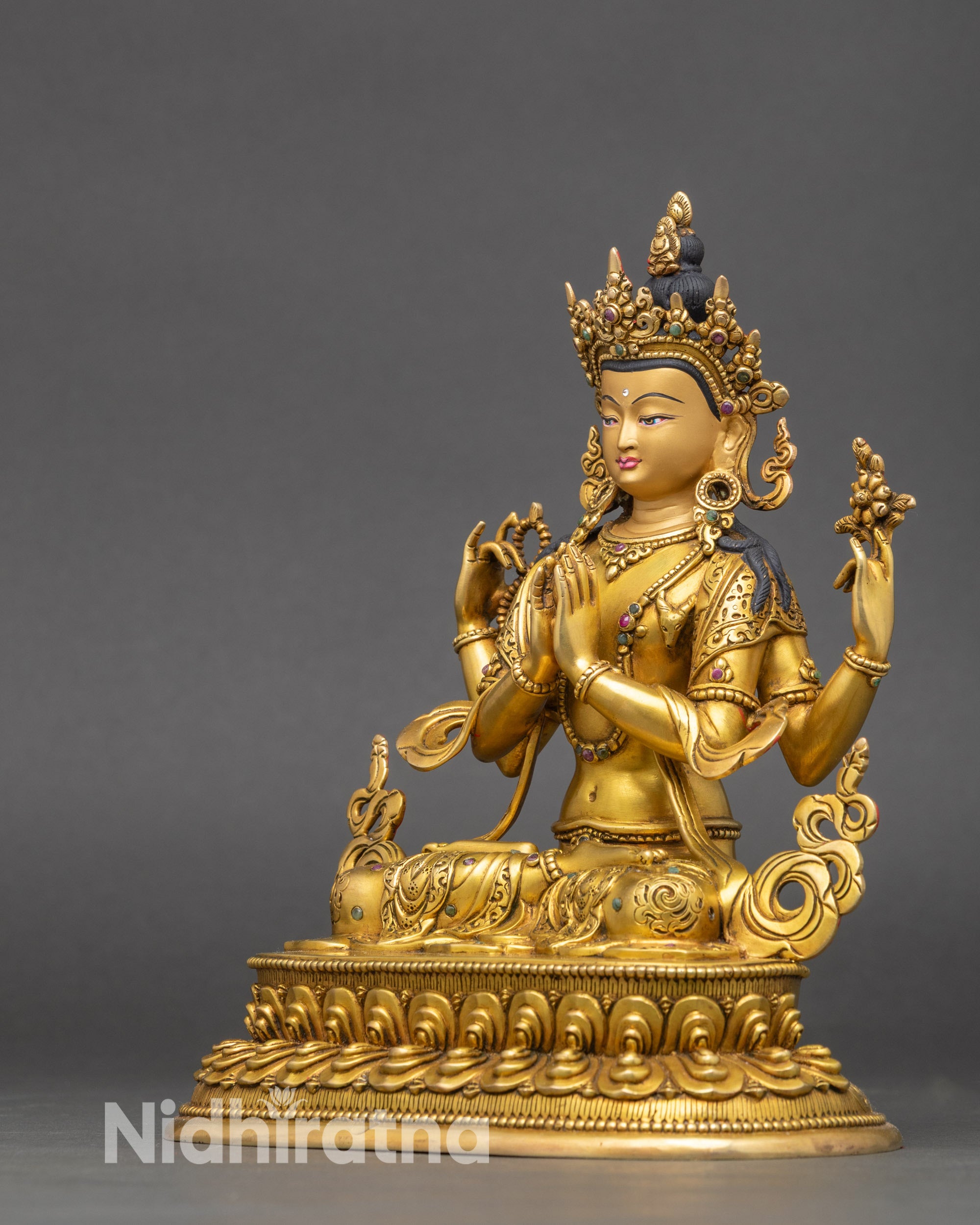 Profile view of Chenrezig Bodhisattva on lotus pedestal with intricate ornamentation