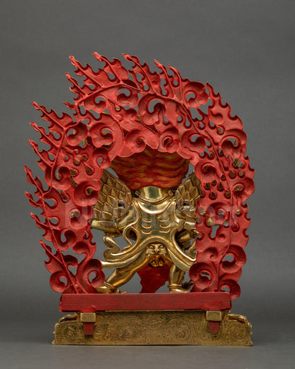 Back view of Hayagriva statue showing giant halo, detailed lower garments, and flowing robe.