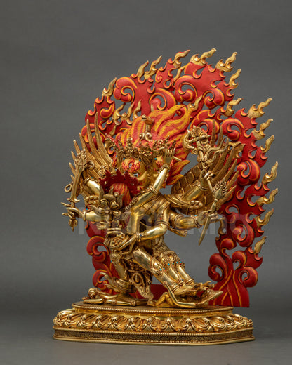 Left side view of gold-fire gilded Hayagriva statue with consort, flowing robe, and detailed lower garments.