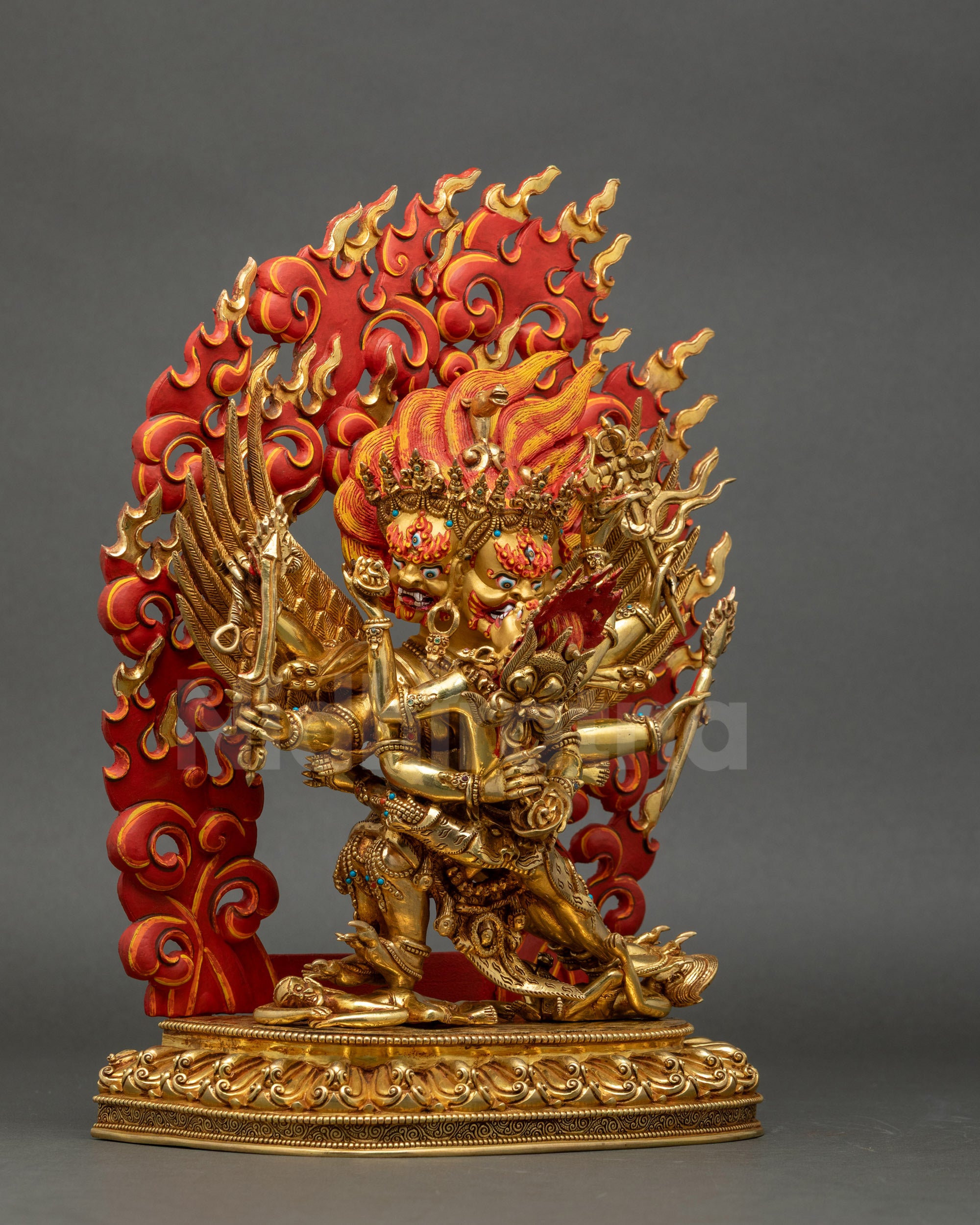 Right side view of six-armed Hayagriva statue standing on lotus, adorned with crown, jewelry, and sacred objects.