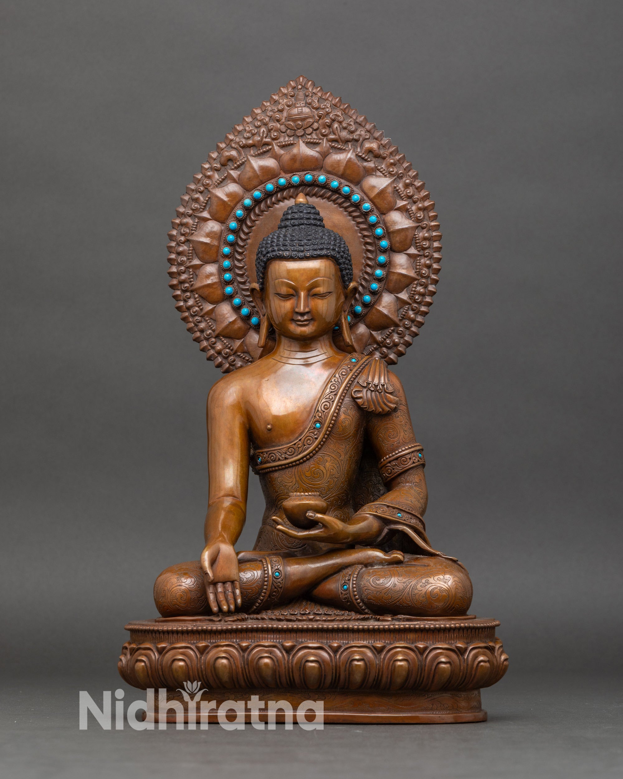 Ratnasambhava Buddha statue handcrafted in Nepal, golden finish with halo, wealth deity