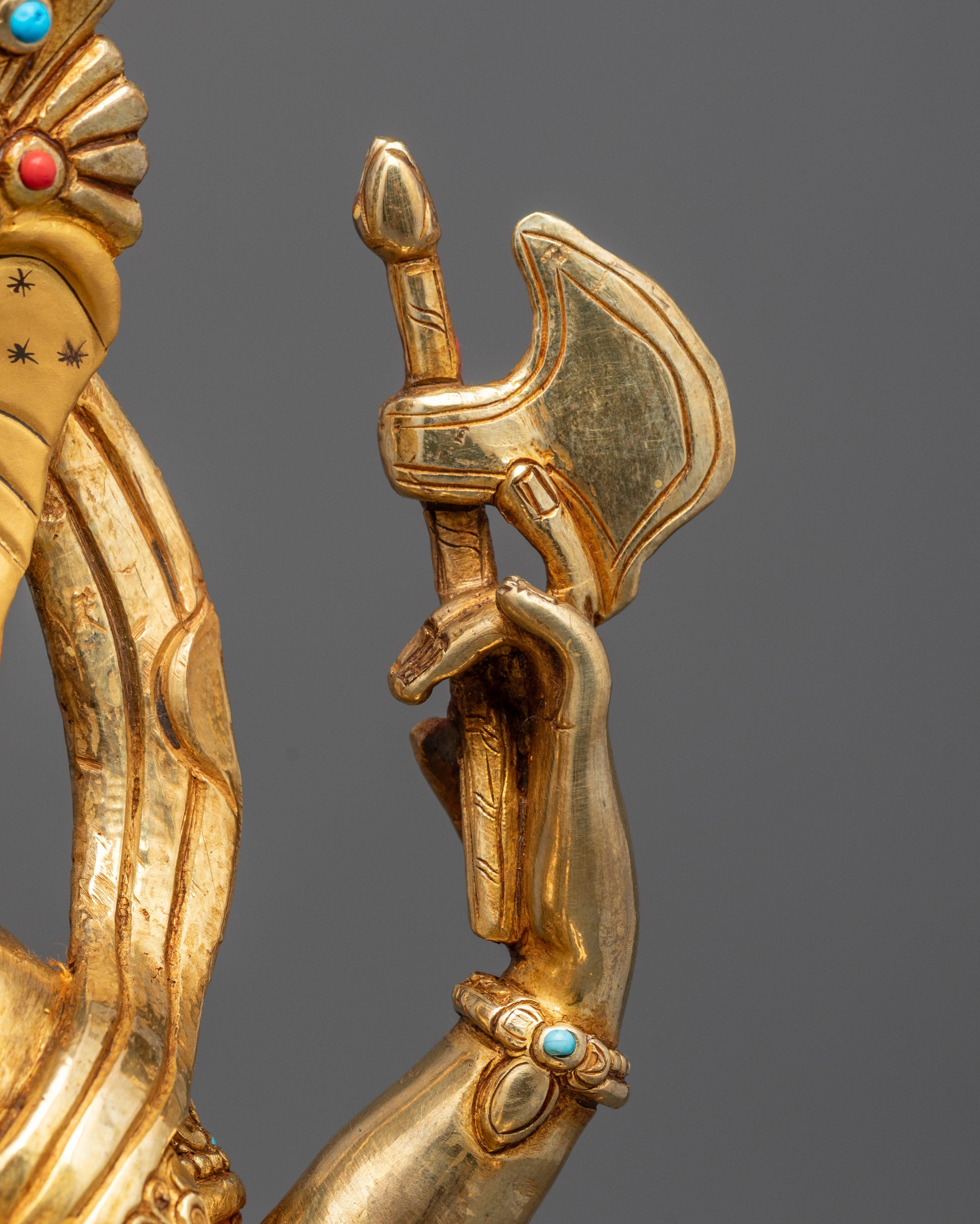 Rear view highlighting the hollow chamber feature and gold-gilded finish