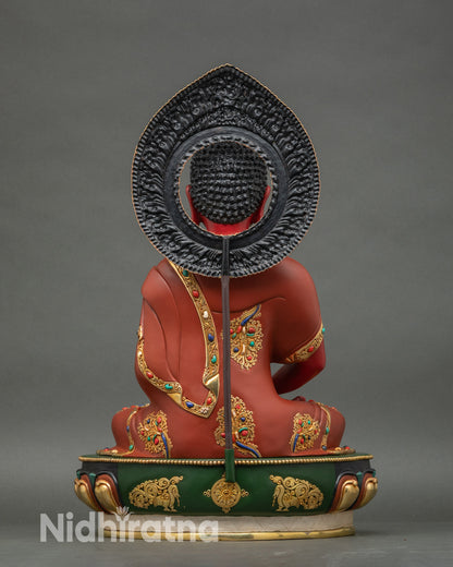 Rear view of Amitabha Buddha statue, showing detailed halo and gold fire-gilded copper finish