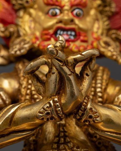 Rear view of Four Armed Vajrapani statue featuring intricate gold gilding, lotus base