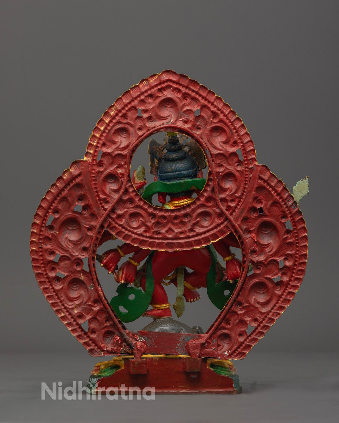 Ganesh sculpture displaying the sacred hollow chamber for mantras and relics, finished in detailed copper work.