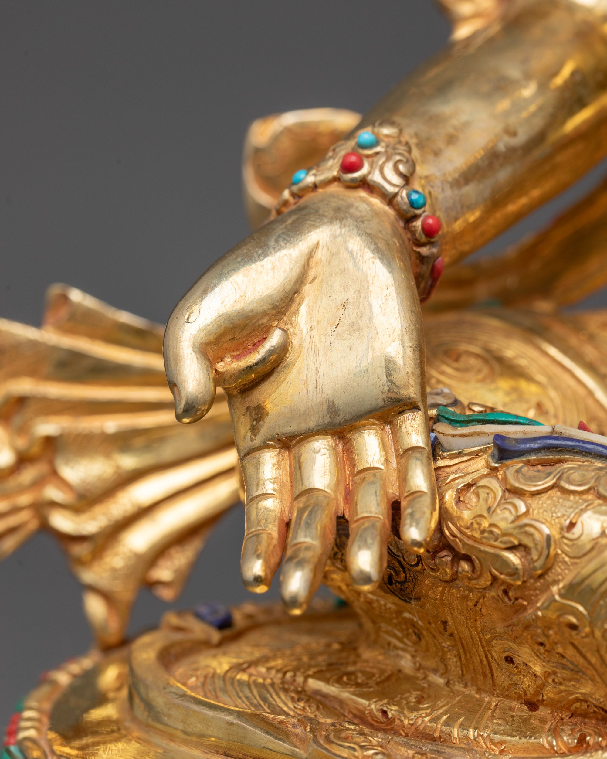 Rear view of Green Tara Statue highlighting the flowing robes, ornate lotus base