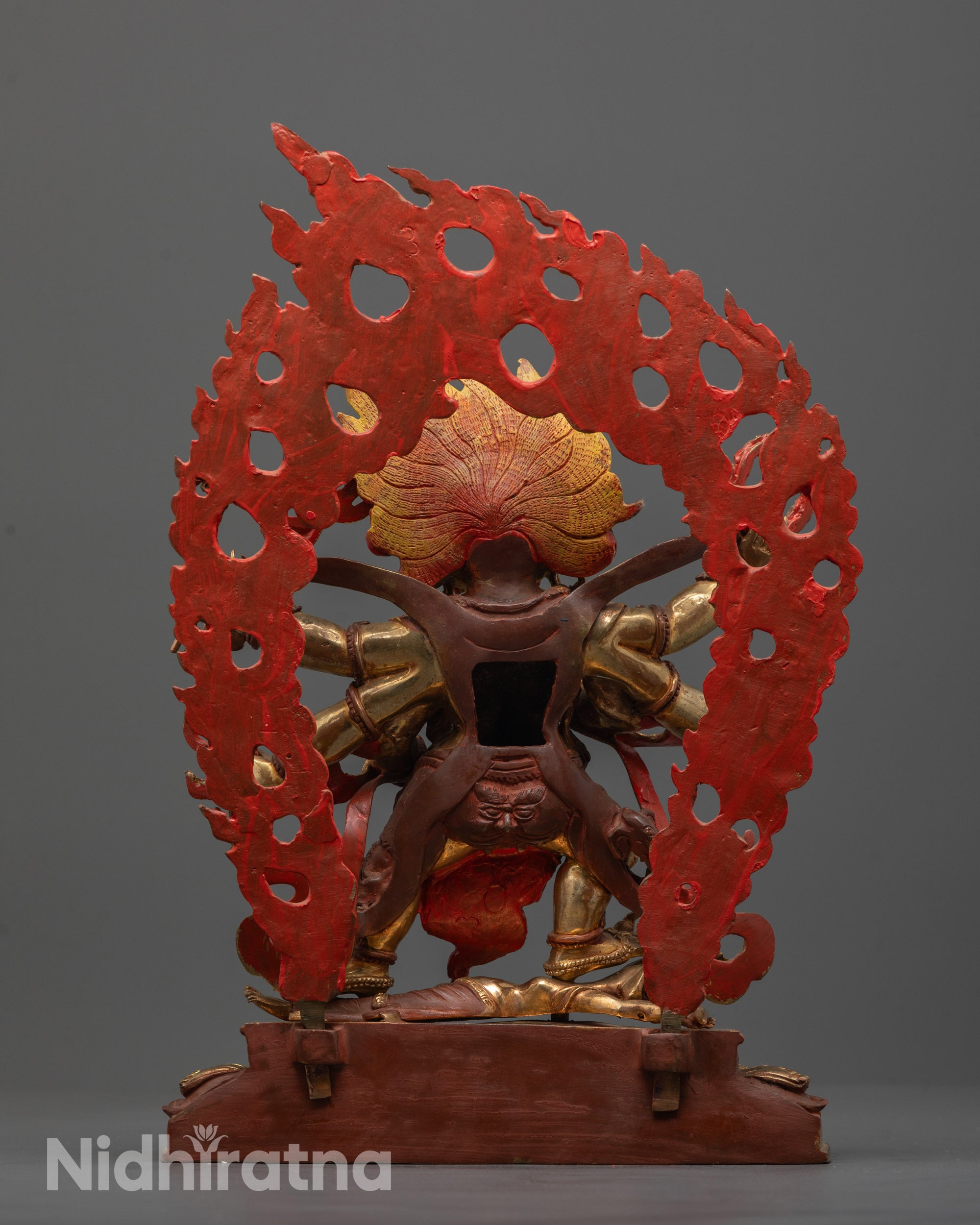 Rear view of Six-Armed Mahakala statue highlighting detailed gold gilding