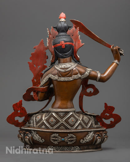 Tibetan Manjushri sculpture highlighting traditional lost wax craftsmanship and symbolic carvings