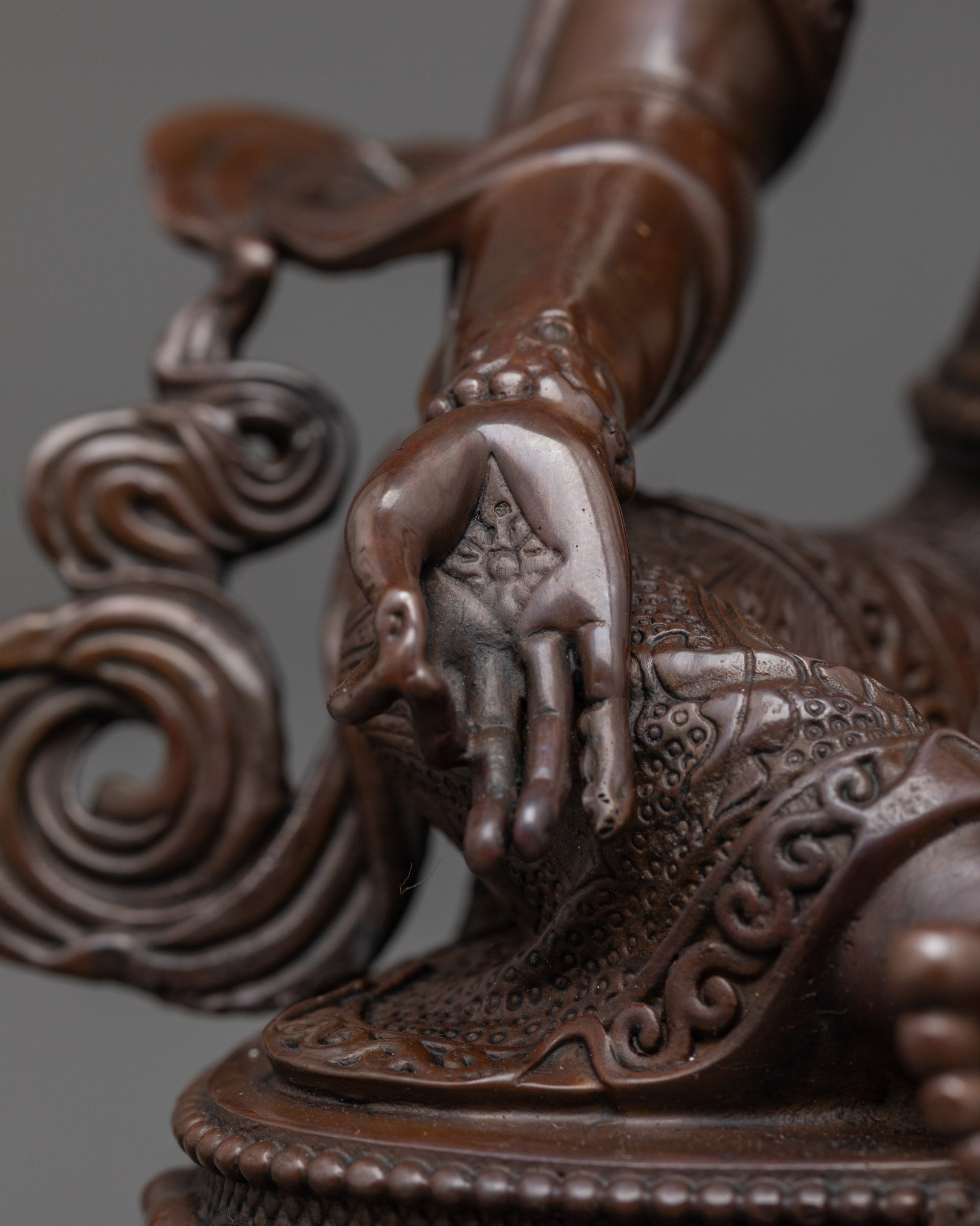 Rear view of machine-crafted Green Tara Statue highlighting intricate carving