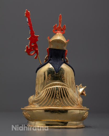 Rear view showing intricate craftsmanship on Guru Rinpoche’s robe and lotus base