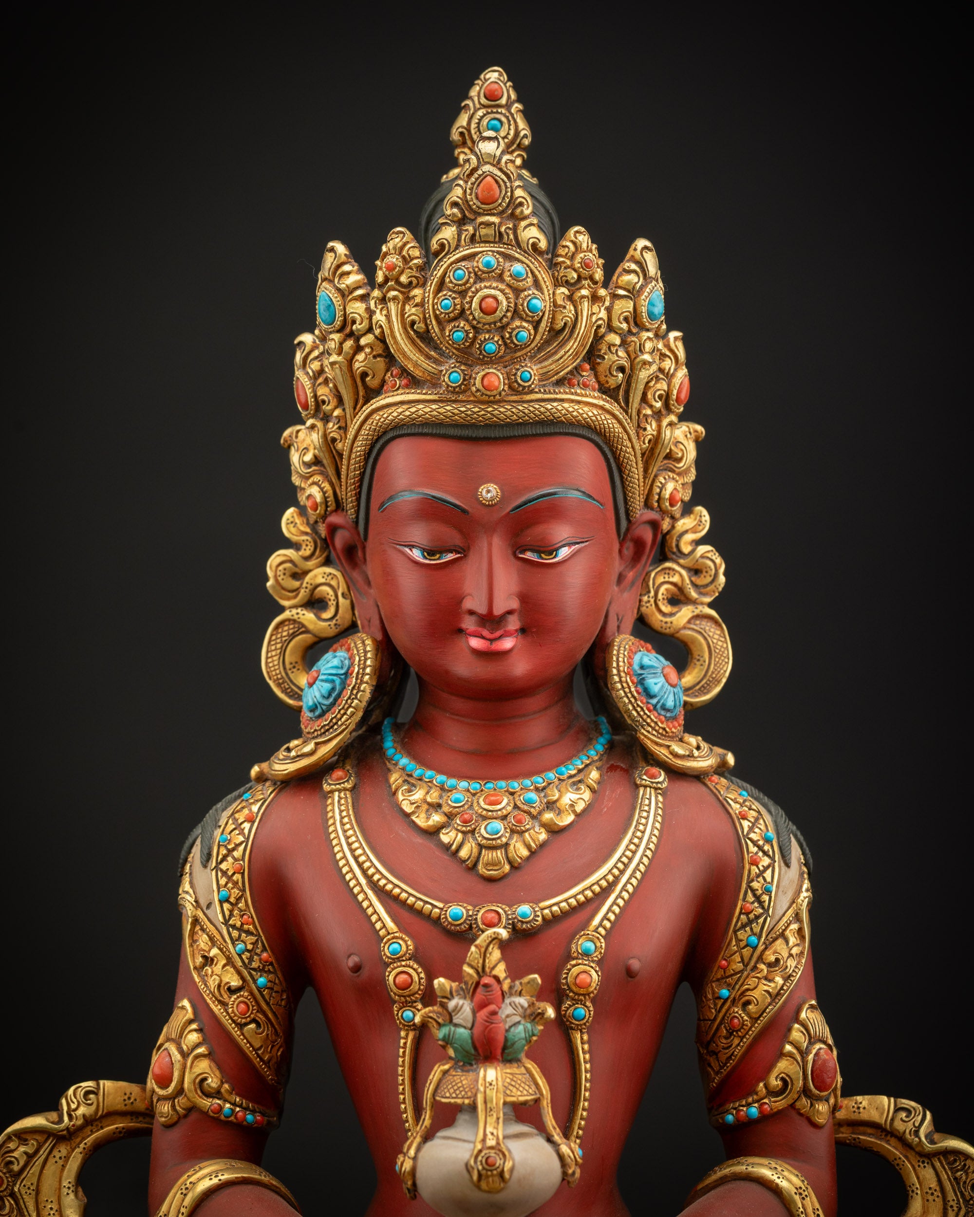 Red Amitayus Masterpiece Statue close-up showing gold-gilded robe and serene expression