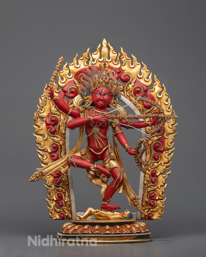 Front-view of Red Kurukulla statue with a bow and arrow, adorned with a golden flaming aureole