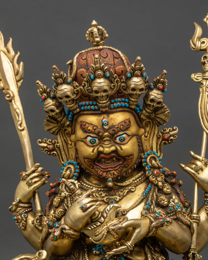 Regular close-up of Four-Armed Mahakala Statue showing detailed copper and gold features