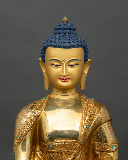 Regular close-up of Shakyamuni Buddha statue showing copper and gold craftsmanship