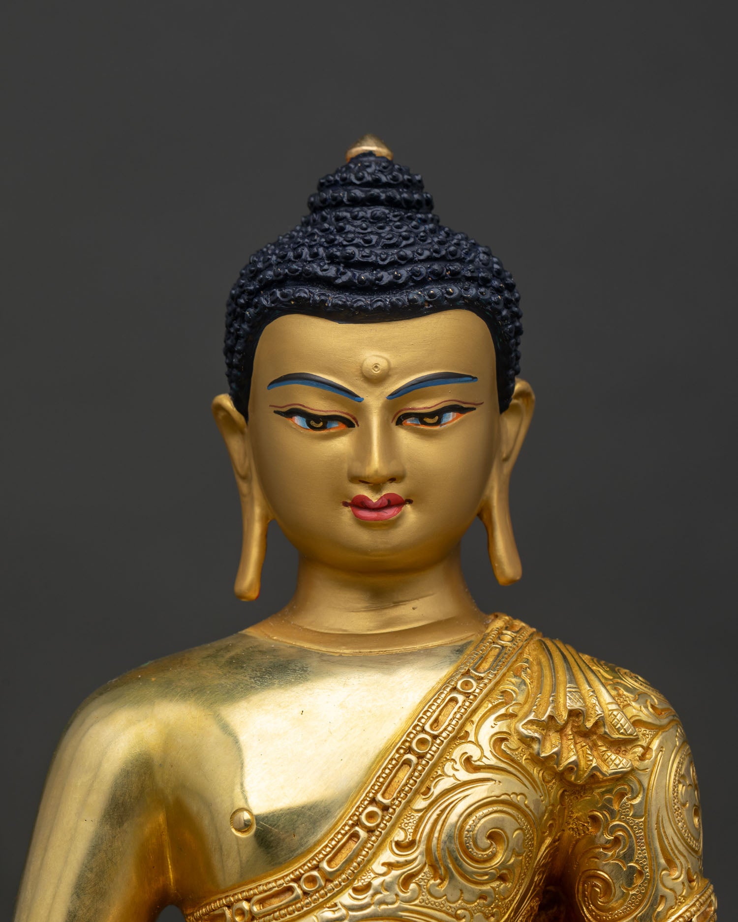 Regular close-up of Amitabha Buddha statue showing copper and gold detailing