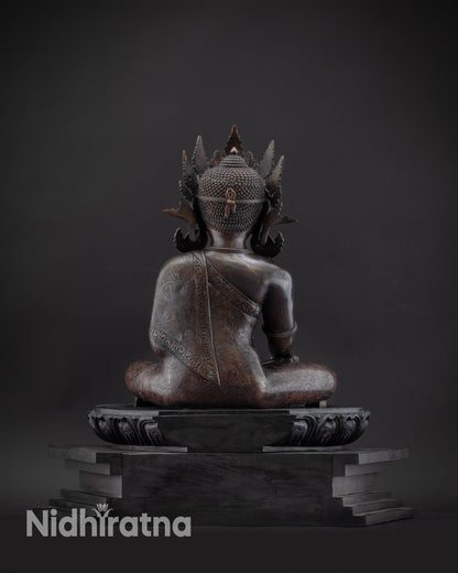 Regular back view oxidized Shakyamuni Buddha statue with carved monk’s robe details
