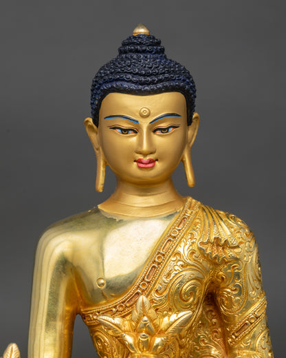 Regular close-up of Bhaisajyaguru statue showing intricate floral monk’s garments