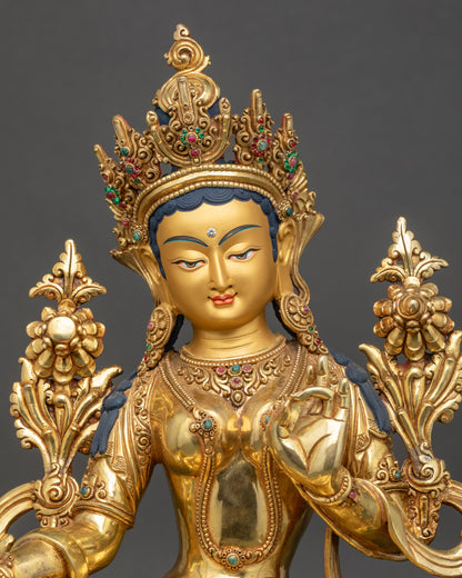 Regular close-up of Green Tara Statue showing intricate gold-gilded details and robes