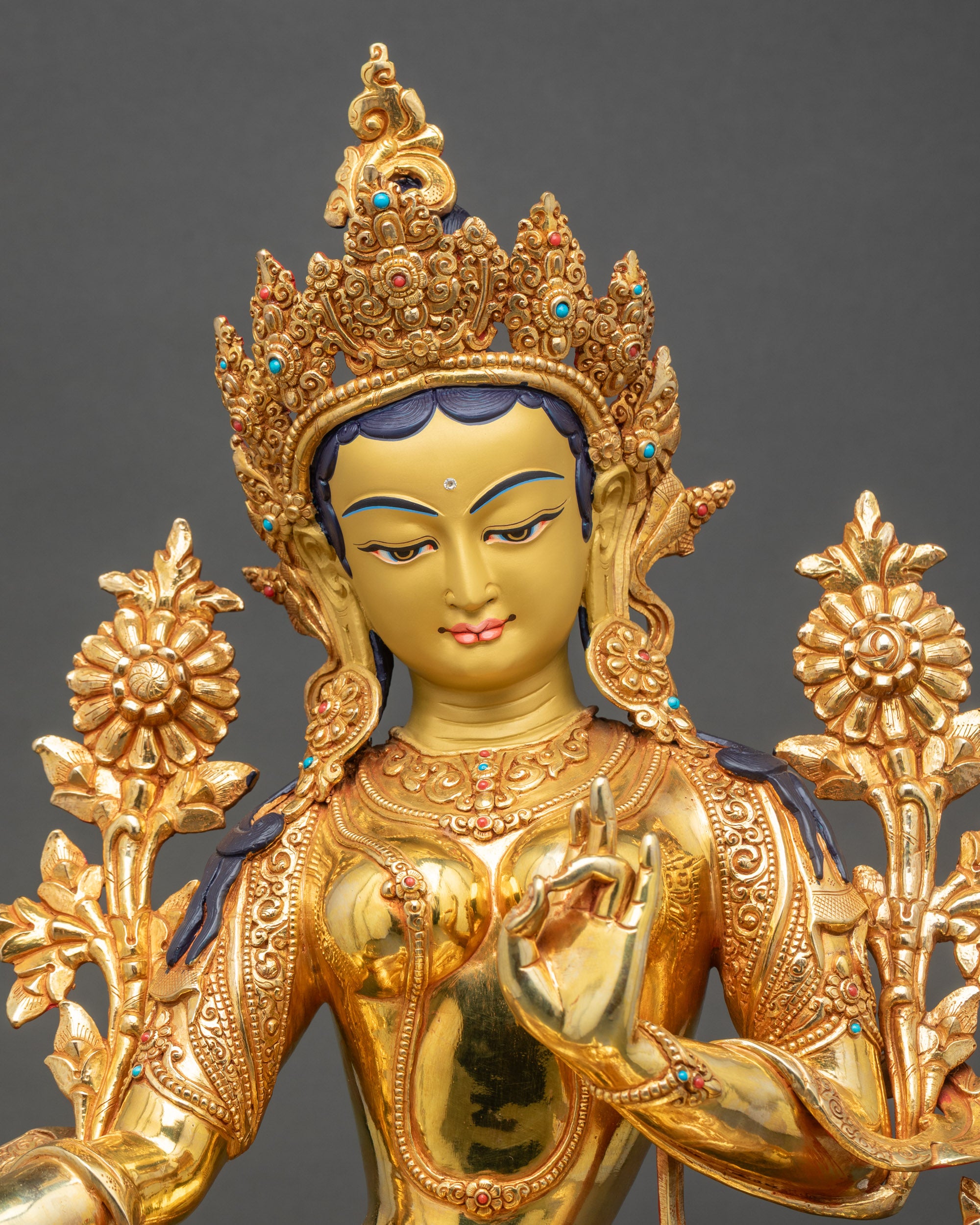 Regular close-up of Green Tara sculpture with intricate hand-carved details