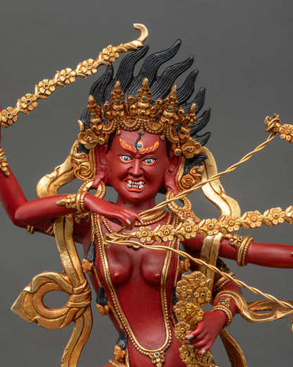 Regular close-up of Kurukulla statue showing flower bow, arrows, hook, and noose details