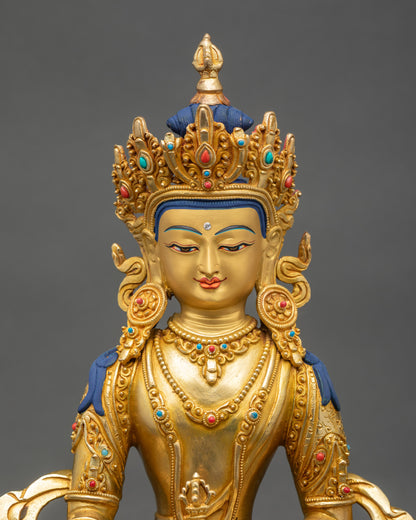 Regular close-up of Mitrugpa sculpture showing intricate copper and gold details